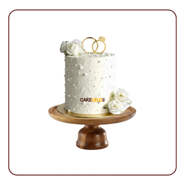 Urban Romance Cake – a modern, geometric tiered wedding cake with metallic accents, perfect for a chic city wedding in Kudasan.