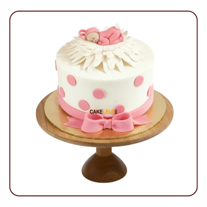 Bundle of Joy Cake for baby shower in Kudasan design  pink frosting, and edible baby topper, best bakery near Urjanagar.