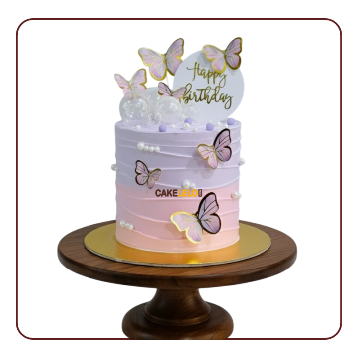 Little Star Delight cake for baby shower in Kudasan , pink and blue color balls with colorful fondant butterfly topper.