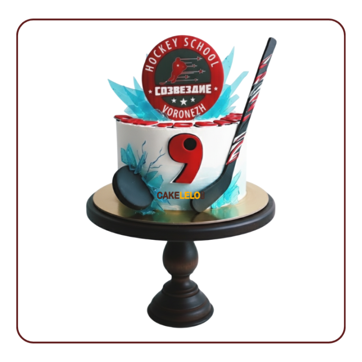 Hockey Hero Cake, 3D fondant puck smashing through, realistic hockey stick, and a team logo topper.