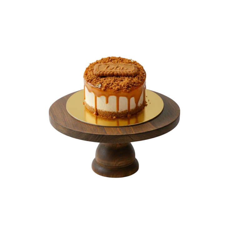 creamy vanilla frosting, Lotus Biscoff spread drip, biscuit crumbs, and a whole Lotus biscuit topper.